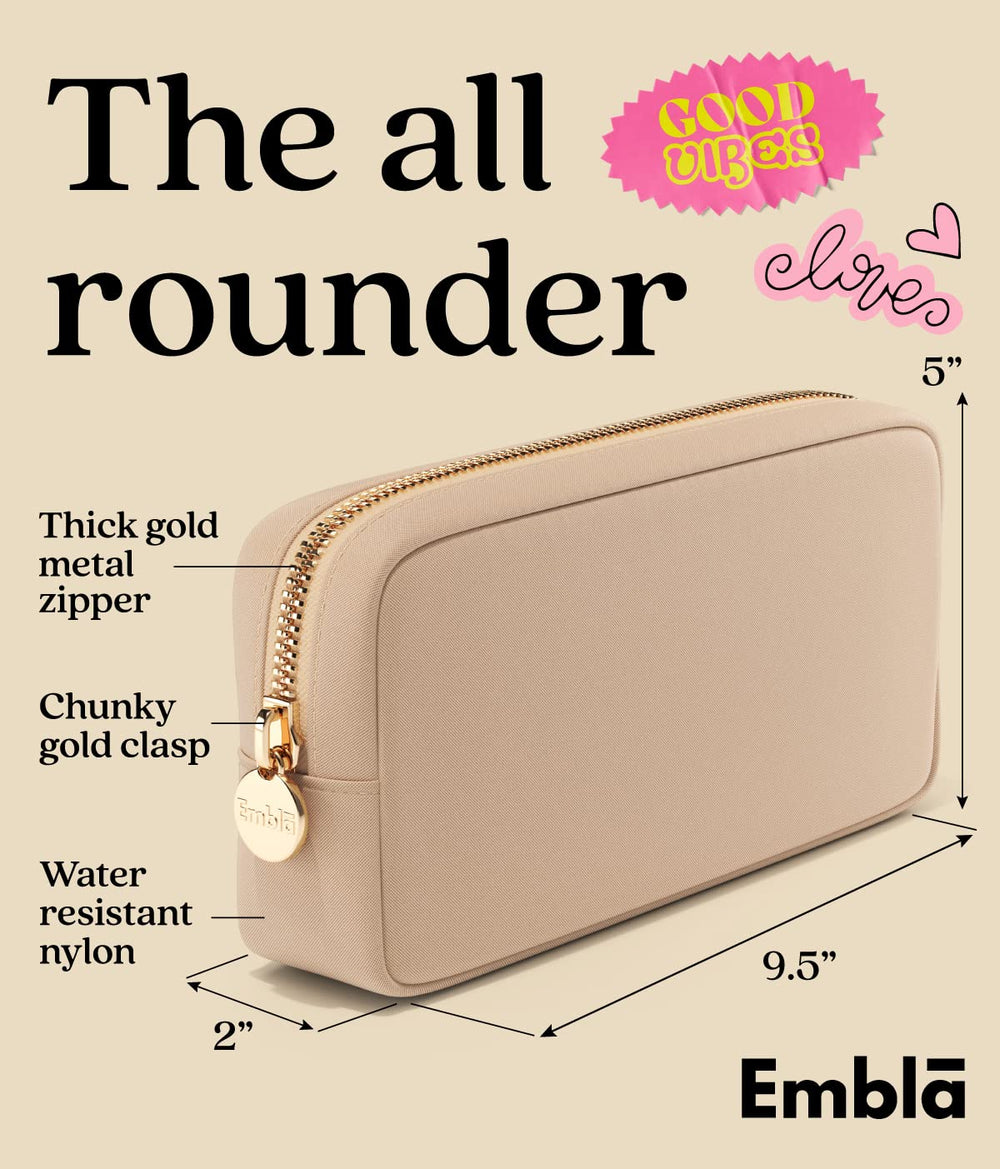 Embla makeup bag sand open compartments demonstrates easy access and organization.
