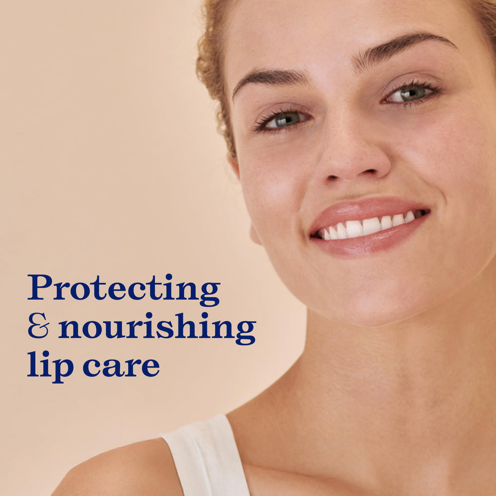Embryolisse lip balm application close-up showing smooth, protective coverage