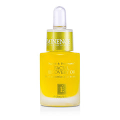 Eminence Facial Recovery Oil drops on hand for hydration.