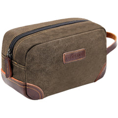 Emissary toiletry bag with leather and canvas material for durable travel.