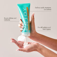 Enjoy Shaping Curly Hair Styling Cream close-up on curls shows soft volume and shine.