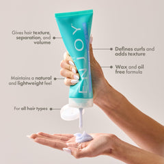 Enjoy Texture Cream applied for textured hair with natural shine.