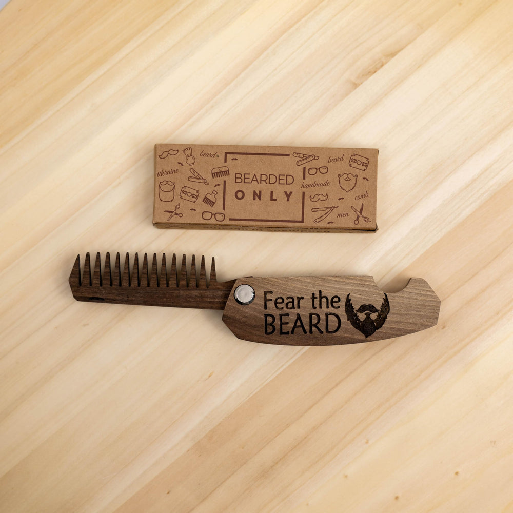 Enjoy The Wood beard comb in-use on-the-go for quick grooming.