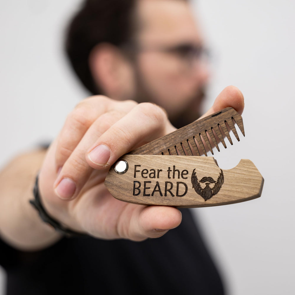 Enjoy The Wood walnut beard comb close-up shows smooth finish and craftsmanship.
