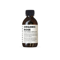 Erbology rose water bottle closeup—premium distillation for gentle skin toning and hydration.