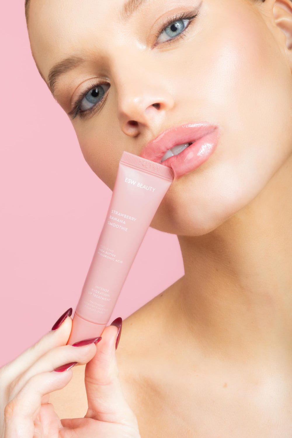 ESW Beauty packaging display photo highlights travel-friendly lip treatment for on-the-go moisture.