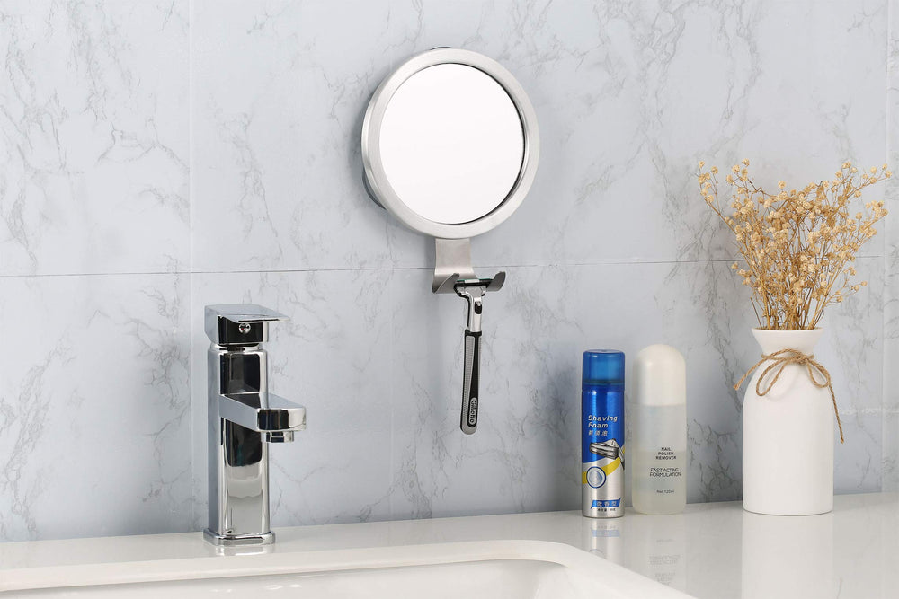 Ettori shower mirror with razor holder keeps grooming tools within reach.