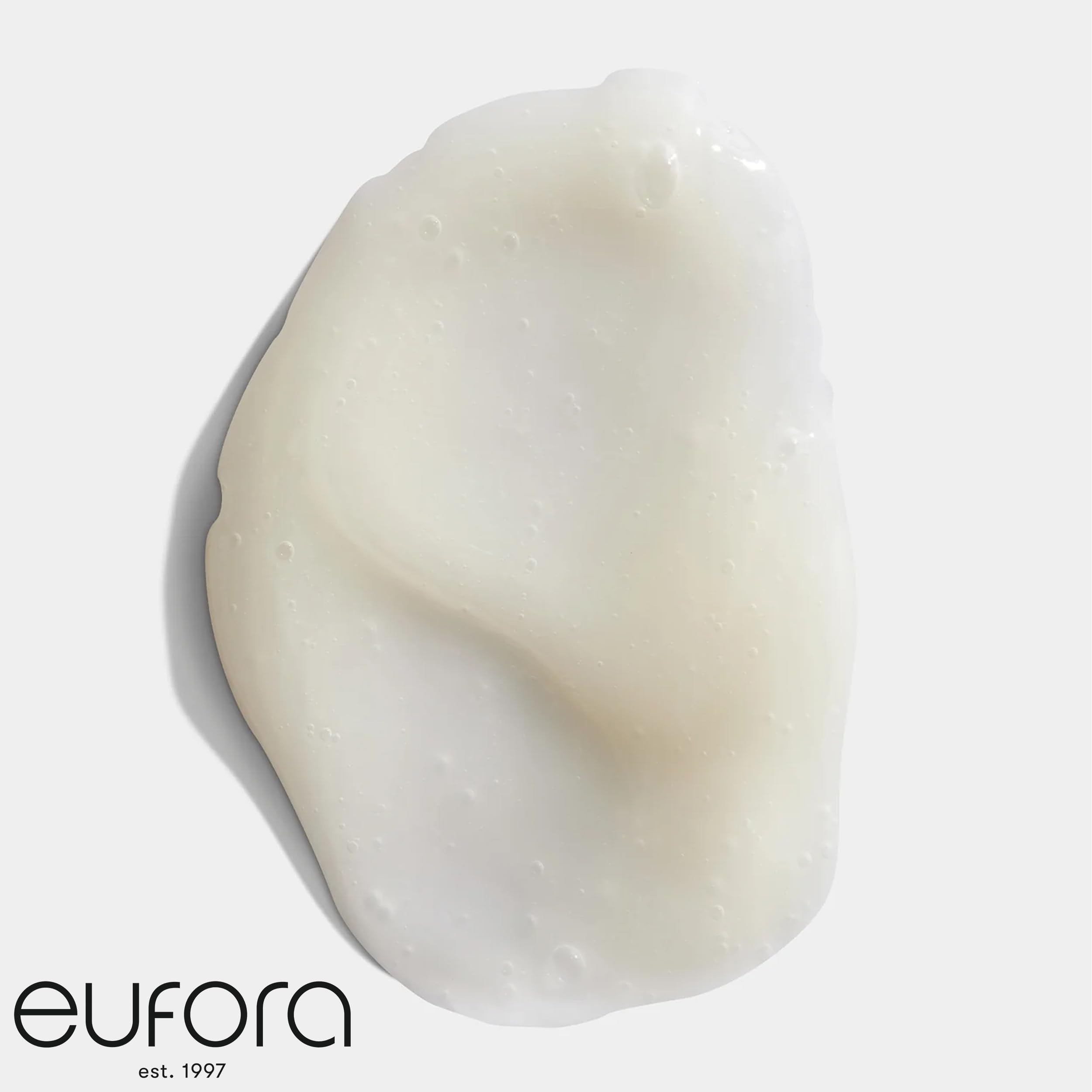 Eufora Beautifying Elixirs Bodifying Shampoo color-safe bottle beside color swatches preserves vibrancy
