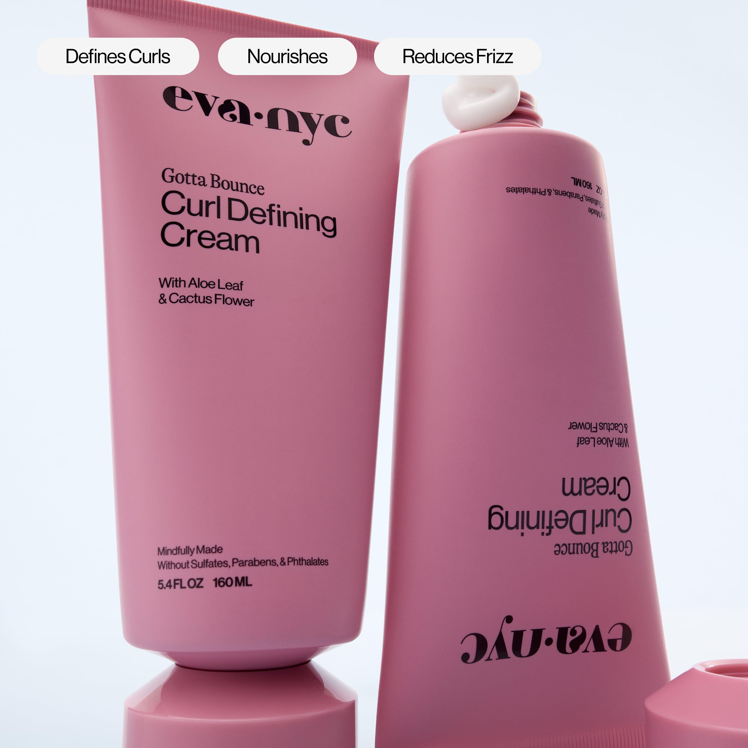 Eva NYC curl cream on hair hints soft, manageable, glossy curls.