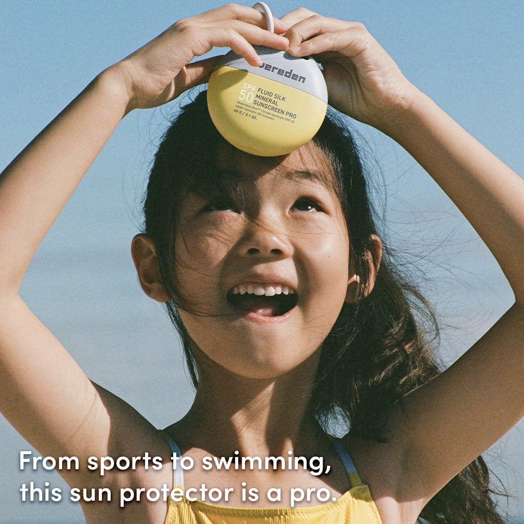 Evereden SPF50 Fluid Silk Mineral Kids Sunscreen being applied to a child during outdoor play.
