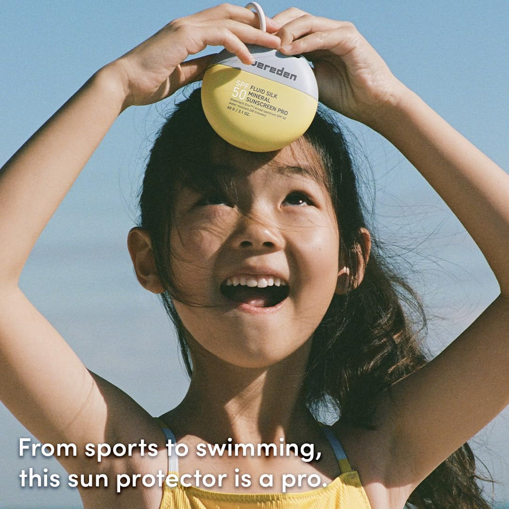 Evereden SPF50 Fluid Silk Mineral Kids Sunscreen being applied to a child during outdoor play.