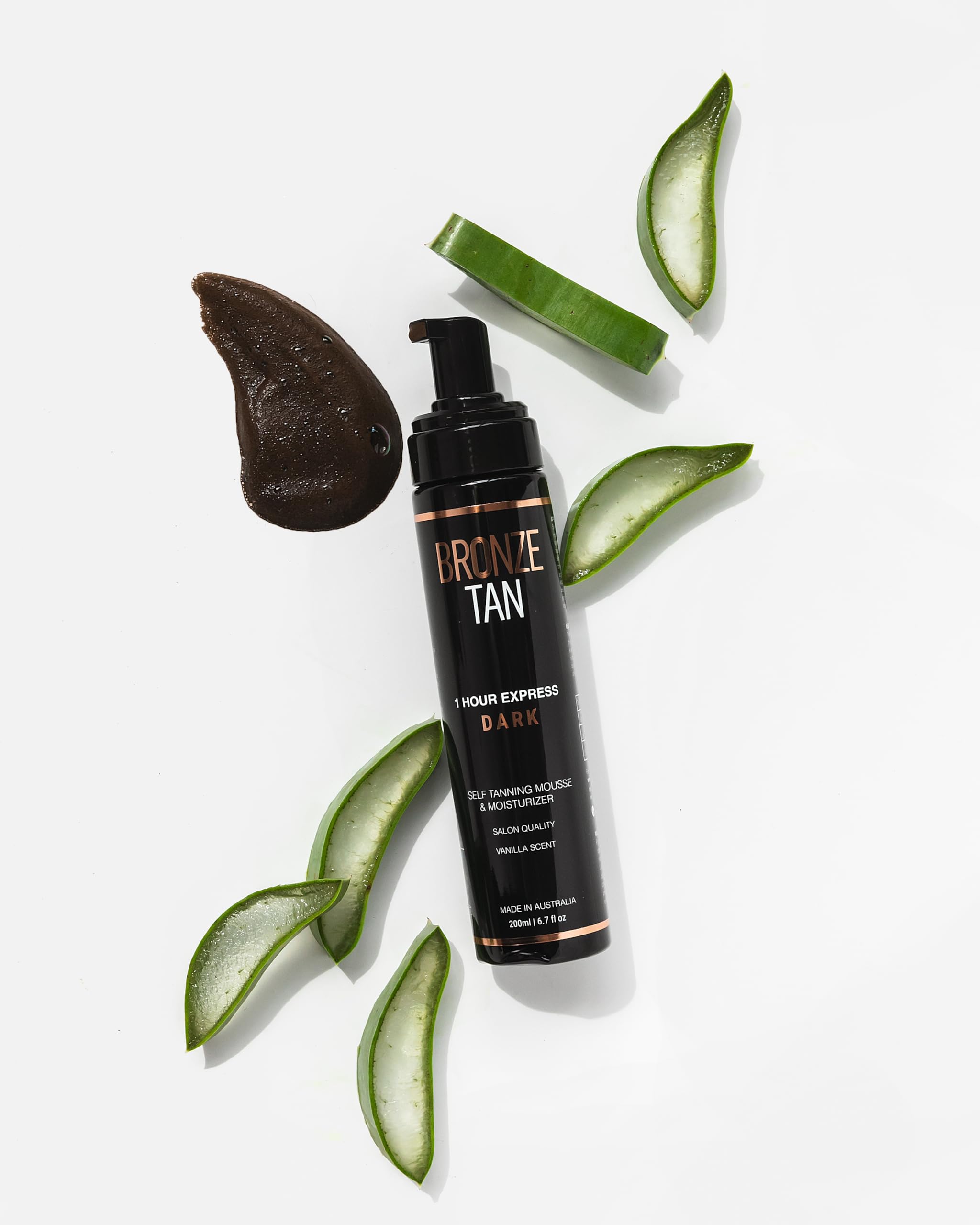 Existing Beauty Bronze Tan Mousse swatch on arm demonstrates gradual color