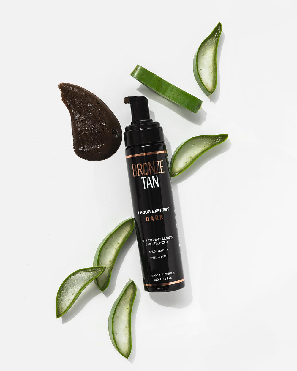 Existing Beauty Bronze Tan Mousse swatch on arm demonstrates gradual color