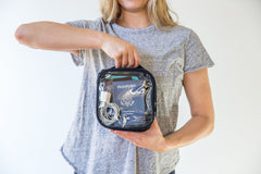 EzPacking see-through vinyl pouch holds electronics cables for organized travel.