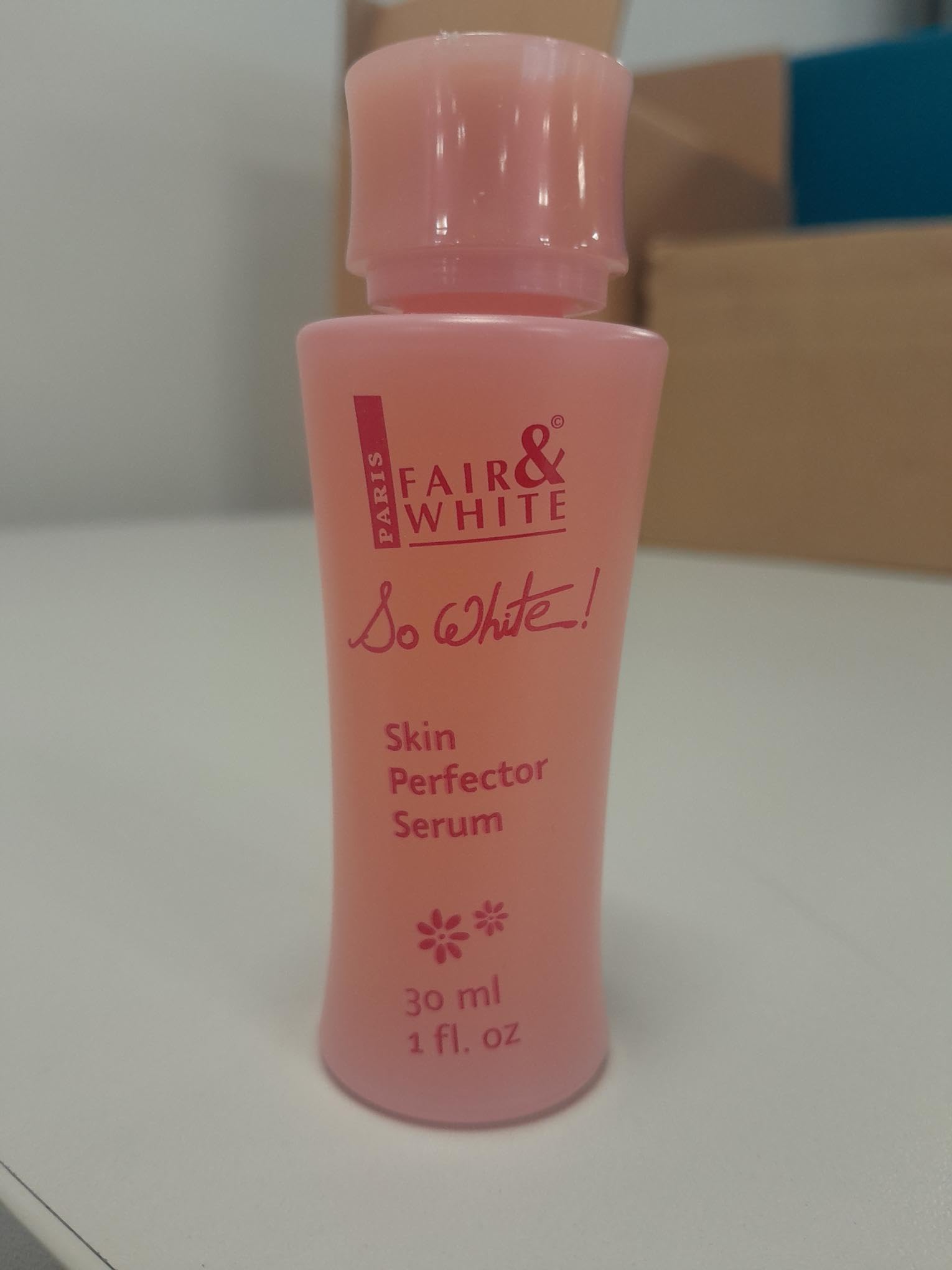 FAIR & WHITE So White serum droplets on skin show smooth, even finish