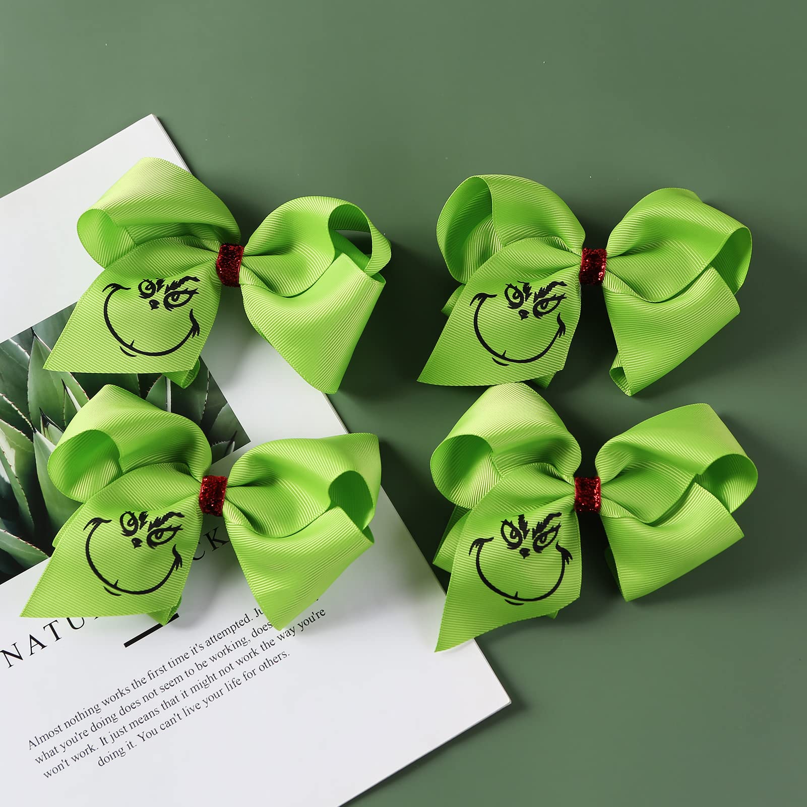 Fancheer 4-pack green hair bows for girls and women to wear.