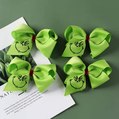 Fancheer 4-pack green hair bows for girls and women to wear.