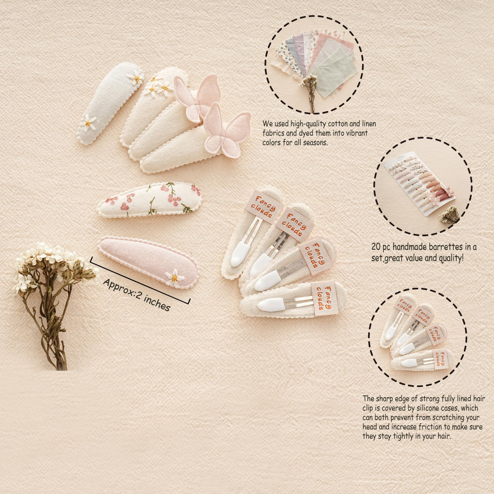 Fancy Clouds neutral fabric snap clip with daisies provides soft touch and versatile styling.