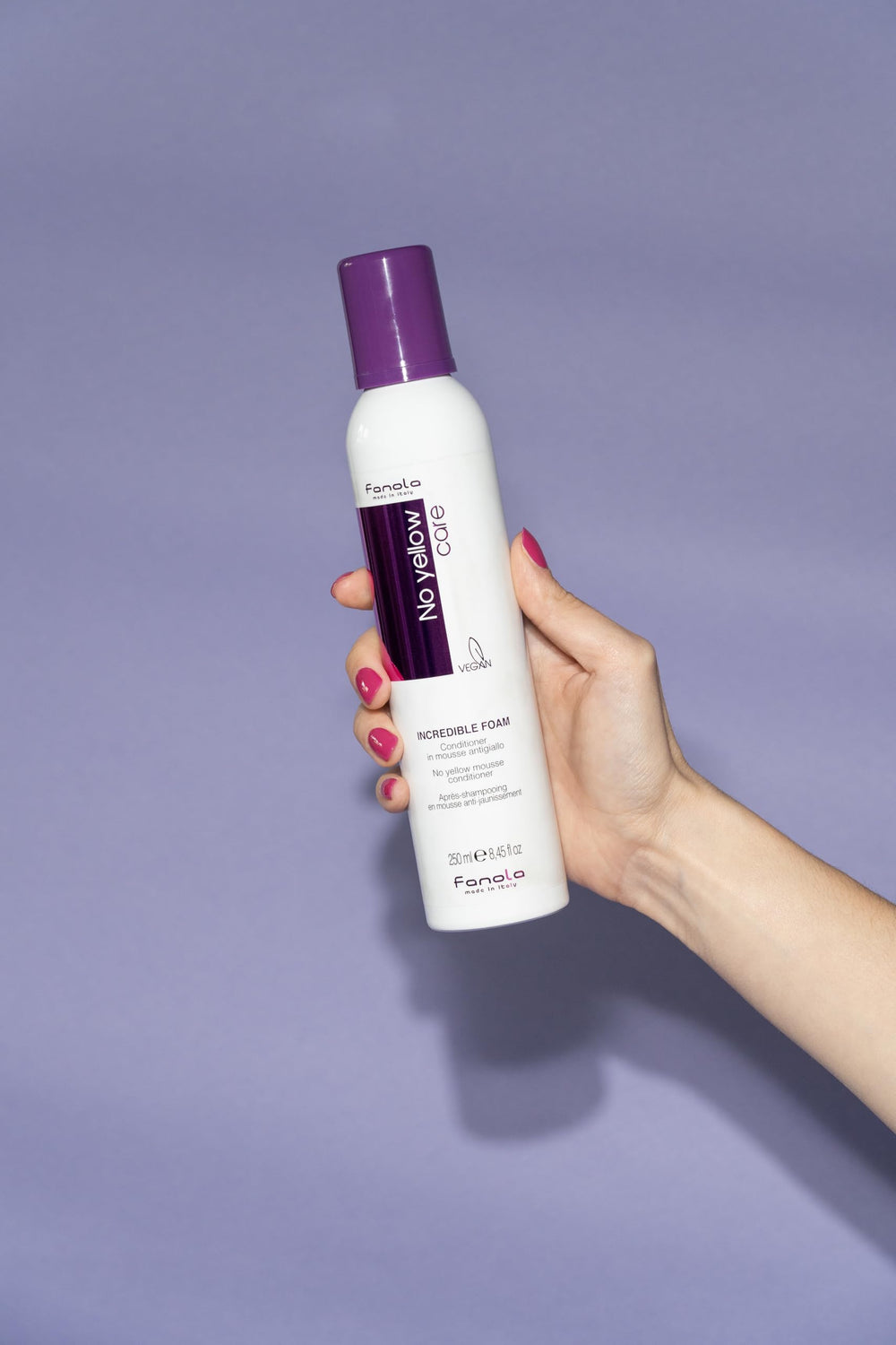 Fanola No Yellow Foam applied to hair during shower for bleached tones.