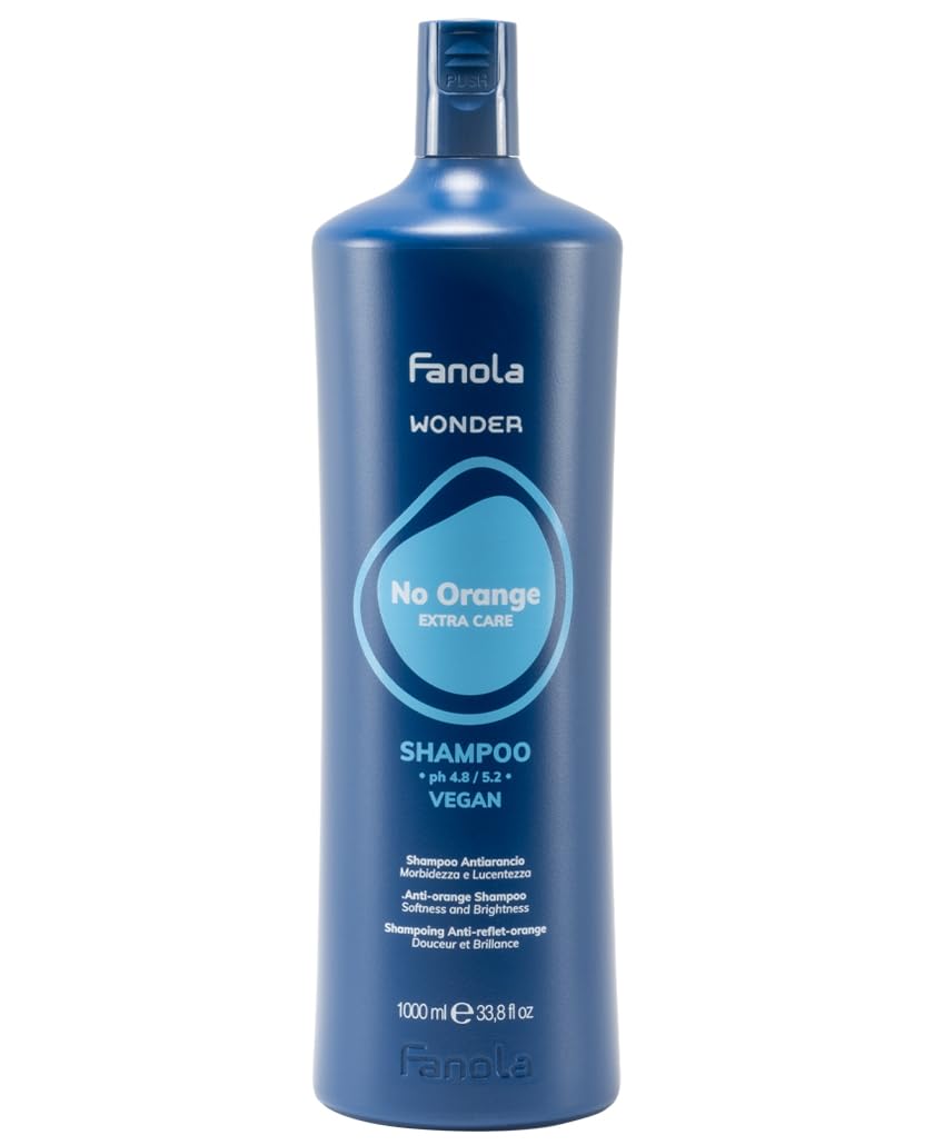 Fanola Wonder No Orange bottle pouring, blue shampoo tones brassy hair for cooler highlights.