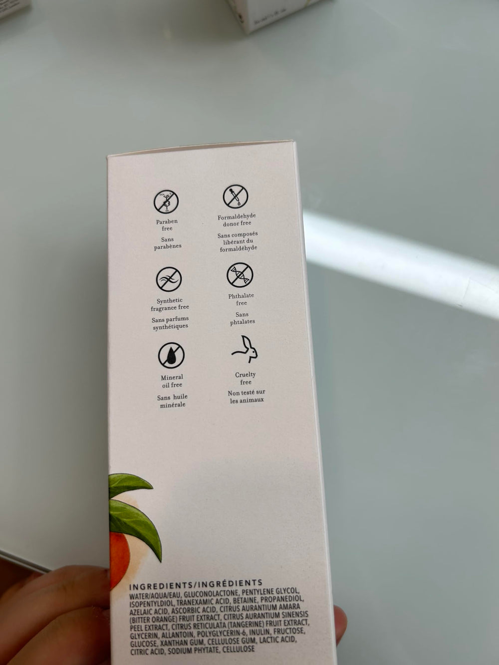 Farmacy 3% TXA Toner glass bottle in bathroom suggesting clearer, radiant skin