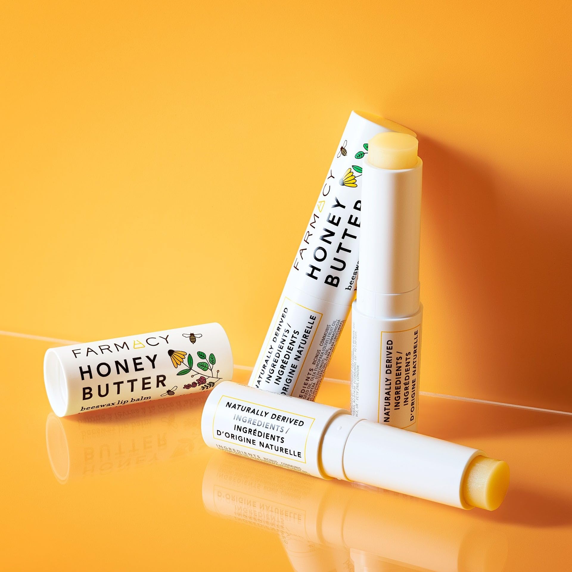 Farmacy beeswax lip balm vitamin E and royal jelly illustration conveys soothing nourishment.