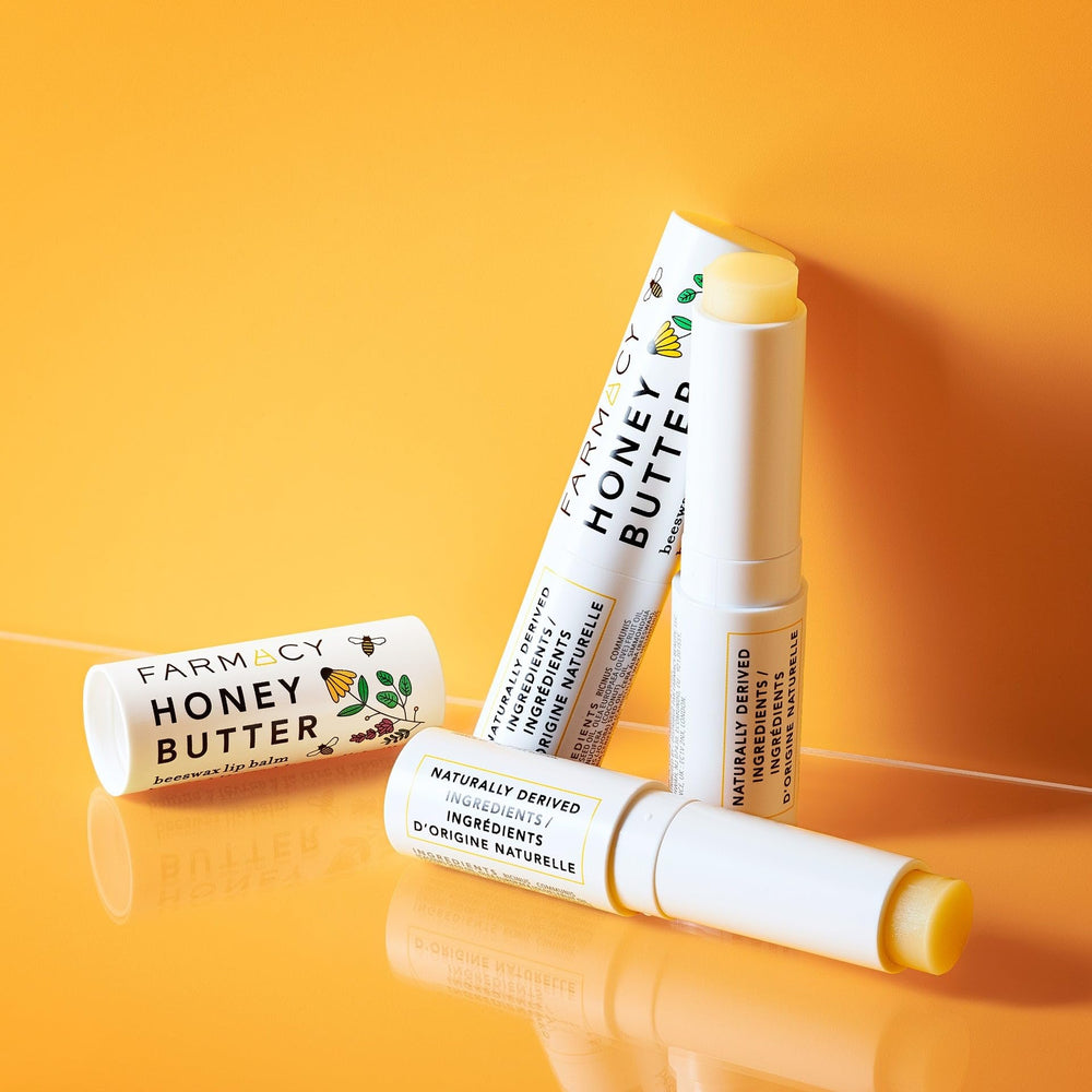 Farmacy beeswax lip balm vitamin E and royal jelly illustration conveys soothing nourishment.