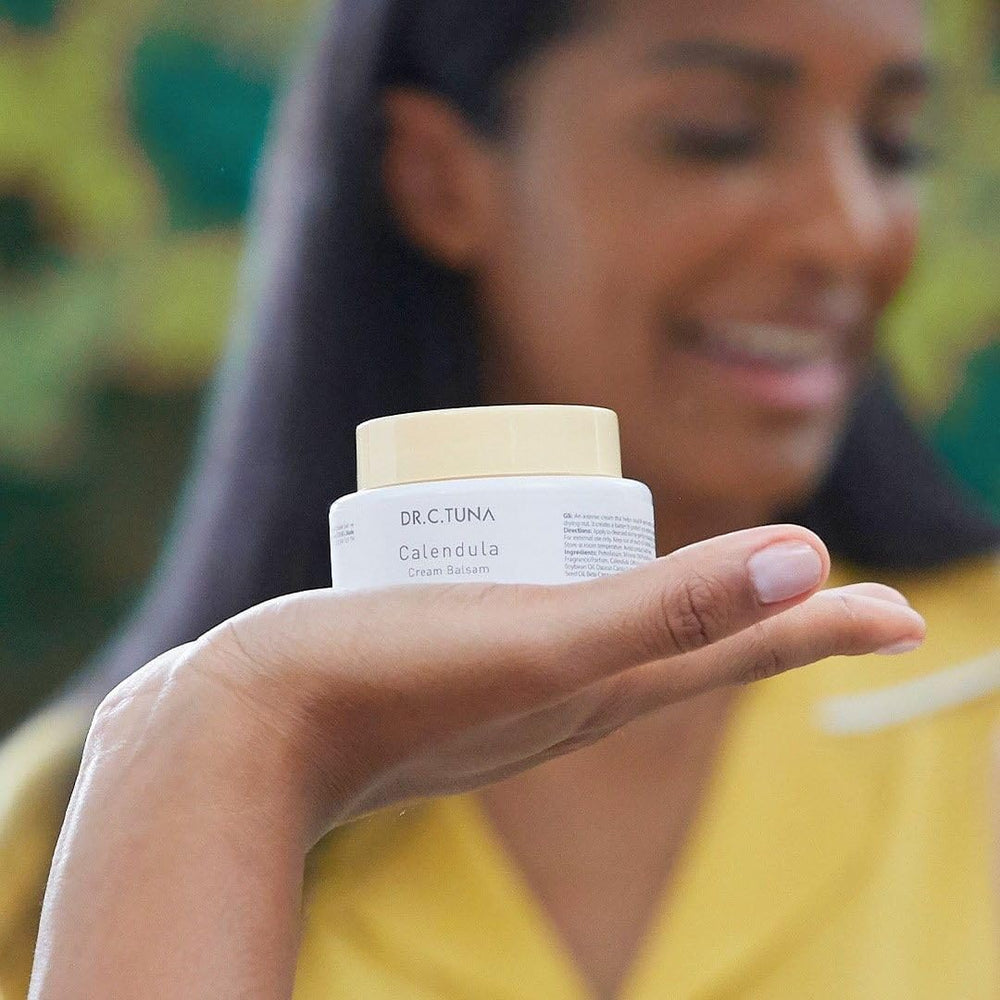 FARMASi Calendula Cream for face and body with creamy texture.