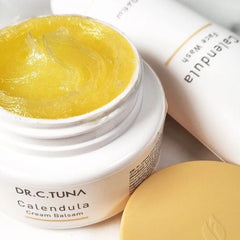 FARMASi Calendula Cream ingredients close-up featuring calendula and oils.