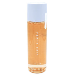 Fenty Skin Fat Water bottle close-up showing pore-refining benefits.