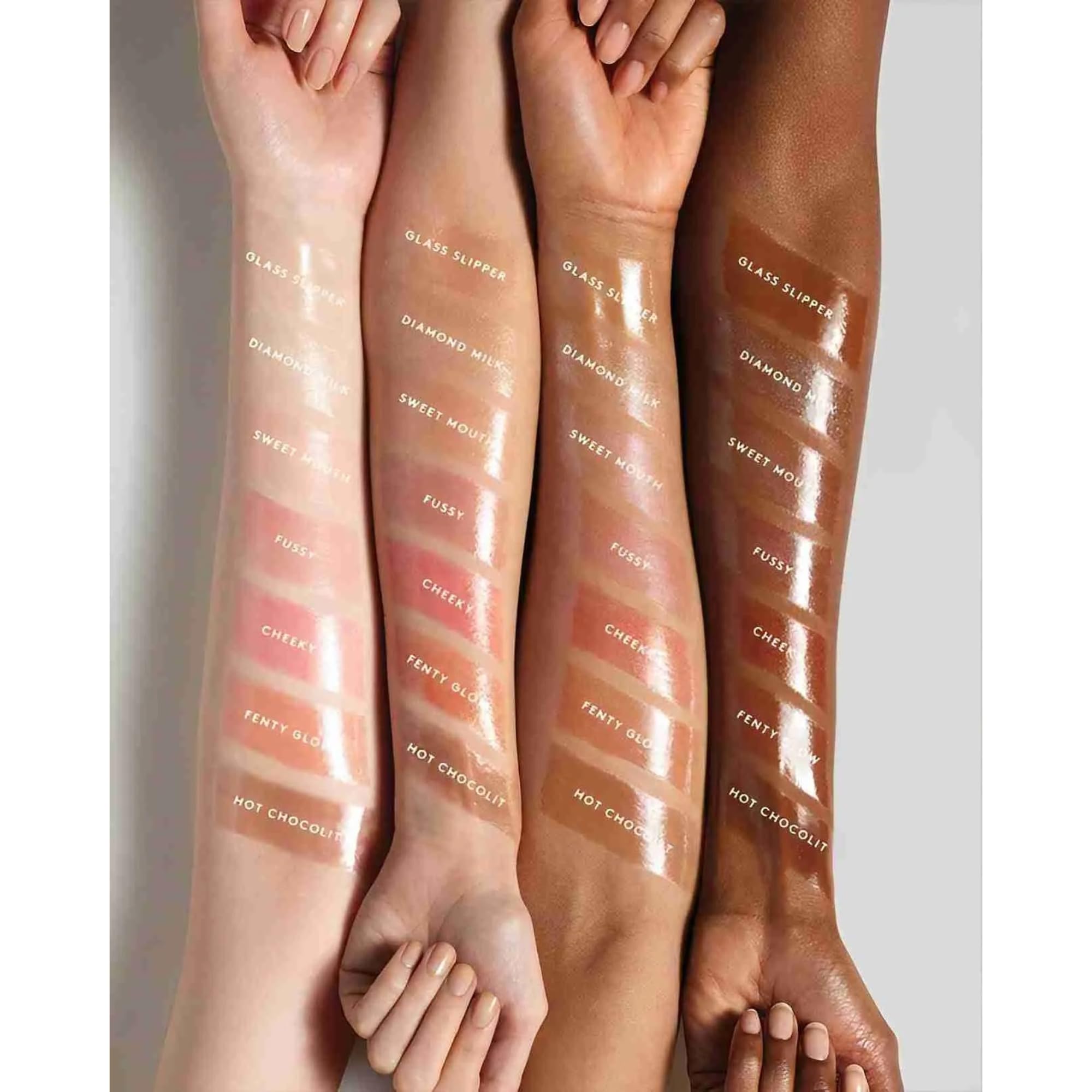 FENTY BEAUTY Gloss Bomb 01 wrist swatch demonstrates sheer luminous color and hydration potential