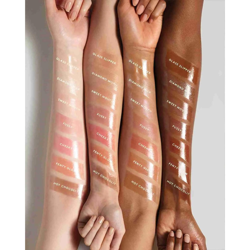 FENTY BEAUTY Gloss Bomb 01 wrist swatch demonstrates sheer luminous color and hydration potential