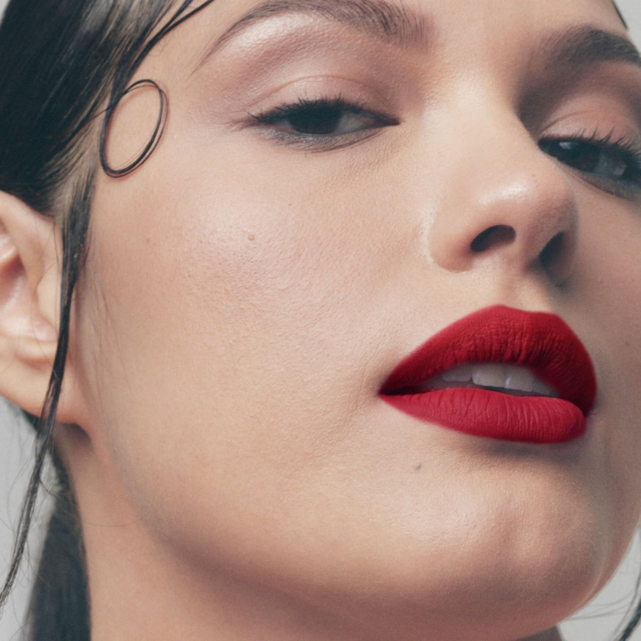 Lips wear Fenty Beauty Icon Velvet Lipstick in soft shade with creamy texture.