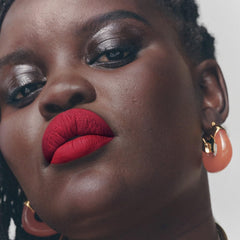 Fenty Beauty Icon Velvet Liquid Lipstick swatches show rich color across skin tones.