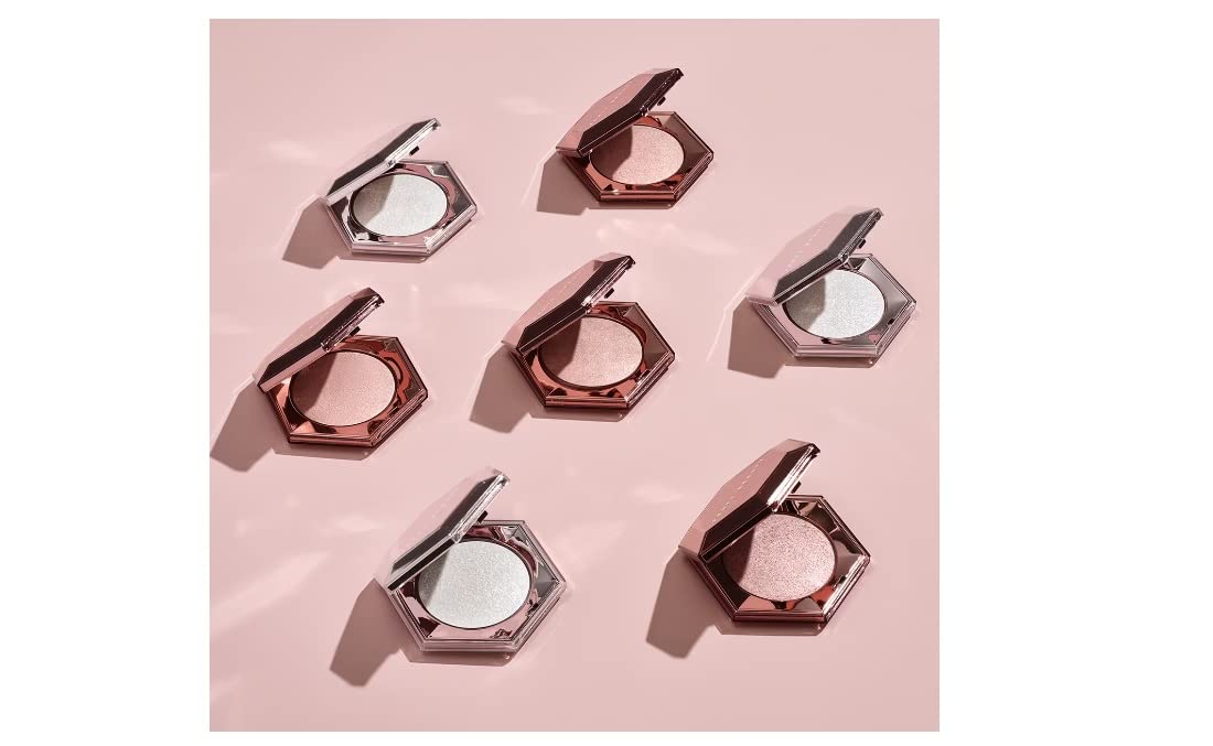 Fenty Diamond Bomb applies as a 3D glitter veil for sparkling skin.