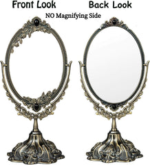 Feyarl bronze table-top mirror on dresser enhancing vintage decor.