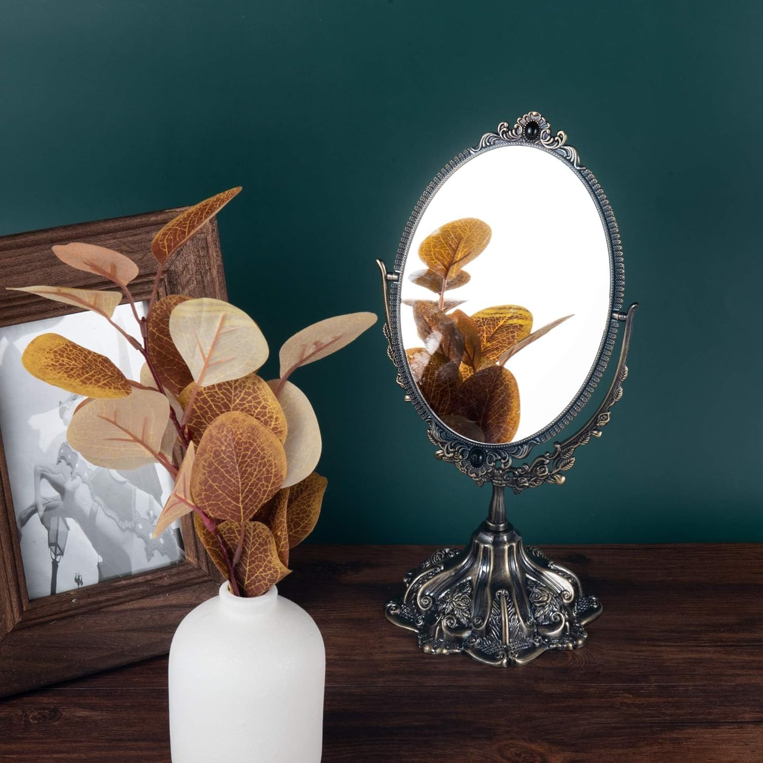Feyarl bronze vintage mirror on dresser complements bedroom aesthetics.