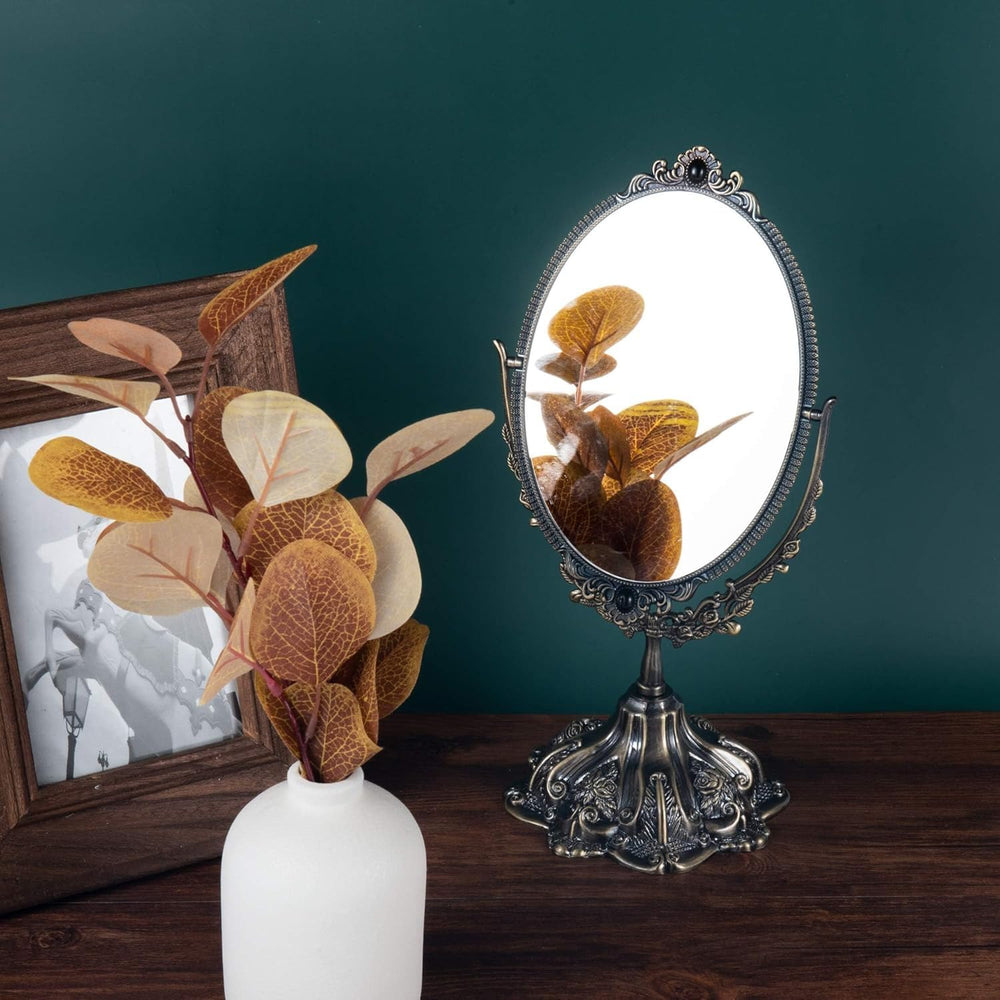 Feyarl bronze vintage mirror on dresser complements bedroom aesthetics.