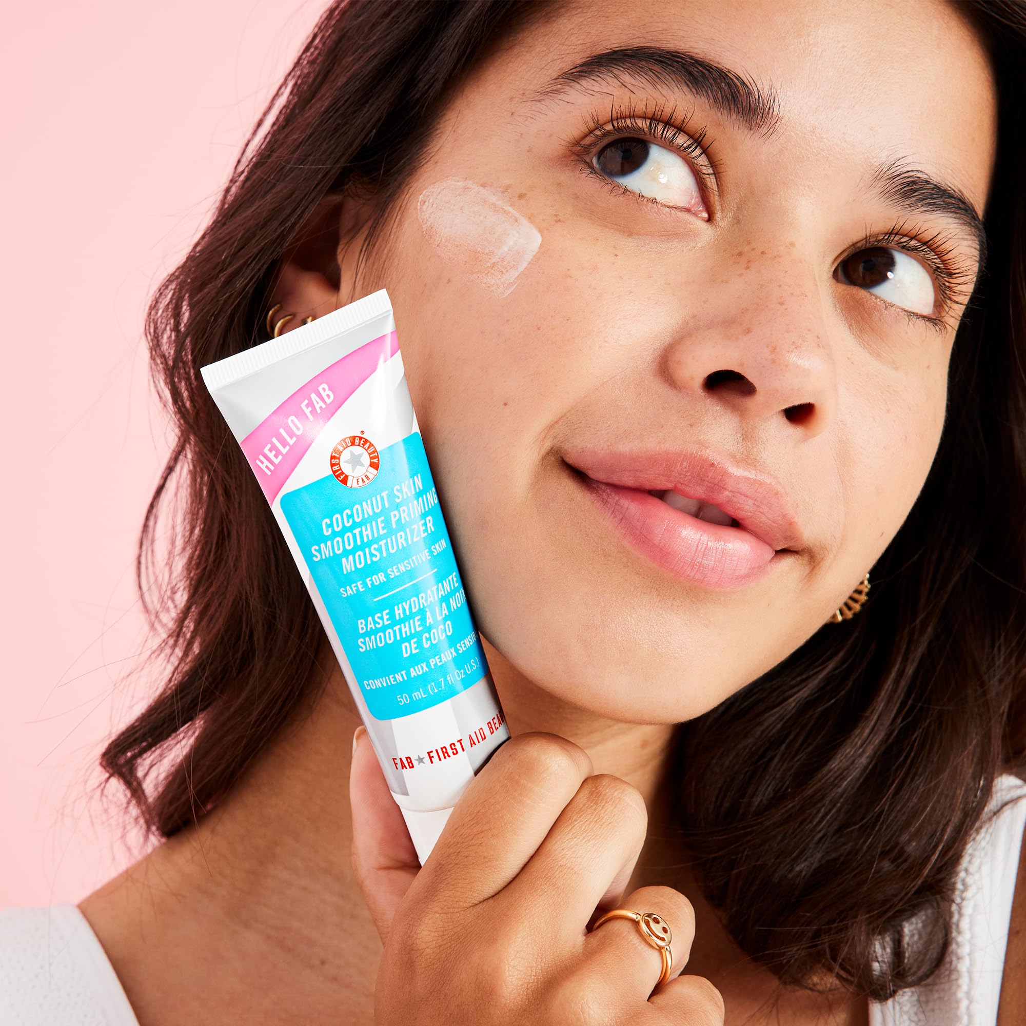 First Aid Beauty Hello FAB coconut skin smoothie application swipe demonstrates dual hydration and makeup grip.