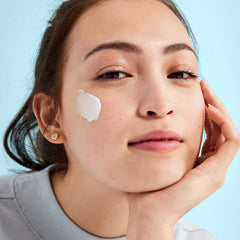 First Aid Beauty Hydra-Firm Night Cream jar closeup showcasing creamy, buttery texture for nourished skin