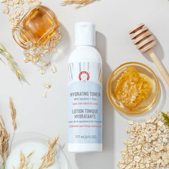 First Aid Beauty hydrating toner bottle closeup highlights creamy texture for soothing routine
