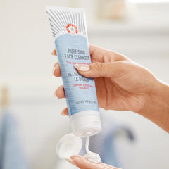 First Aid Beauty Pure Skin Face Cleanser label closeup, antioxidant blend supports calm skin.