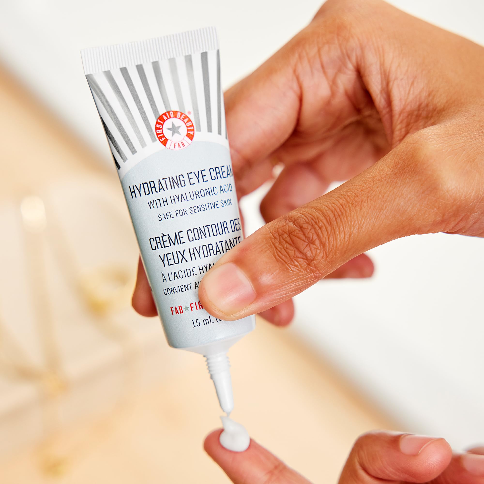 First Aid Beauty Hyaluronic Acid ingredient close-up shows plumping hydration that supports smooth under-eye skin.