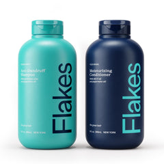 Flakes anti-dandruff shampoo bottle closeup showing sulfate-free care for a healthier scalp.