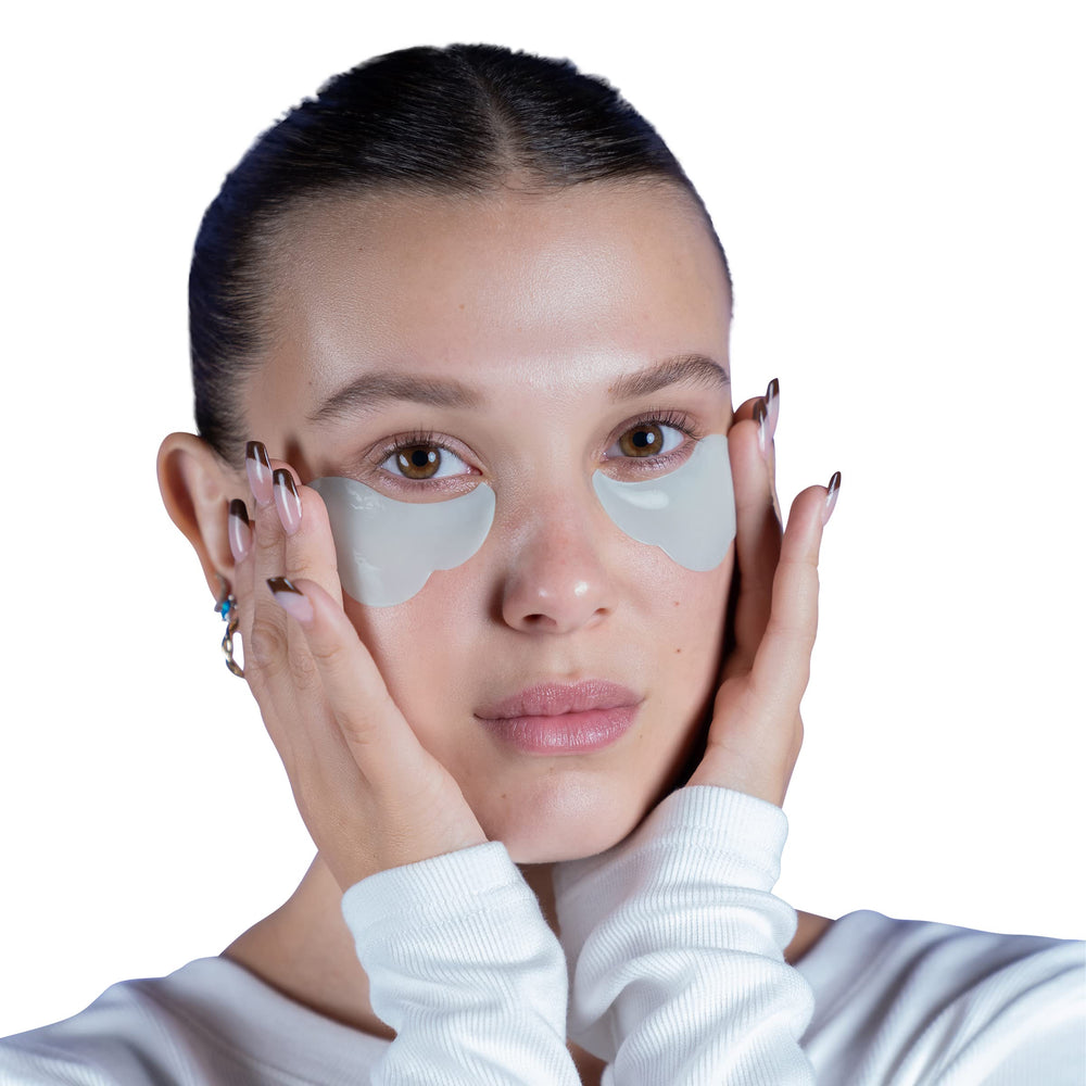Florence by Mills caffeine-infused patches being applied for refreshed-looking under-eye.