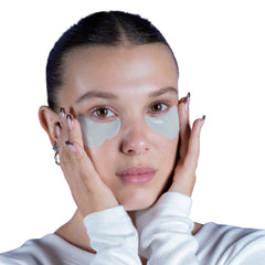 Florence by Mills caffeine-infused patches being applied for refreshed-looking under-eye.