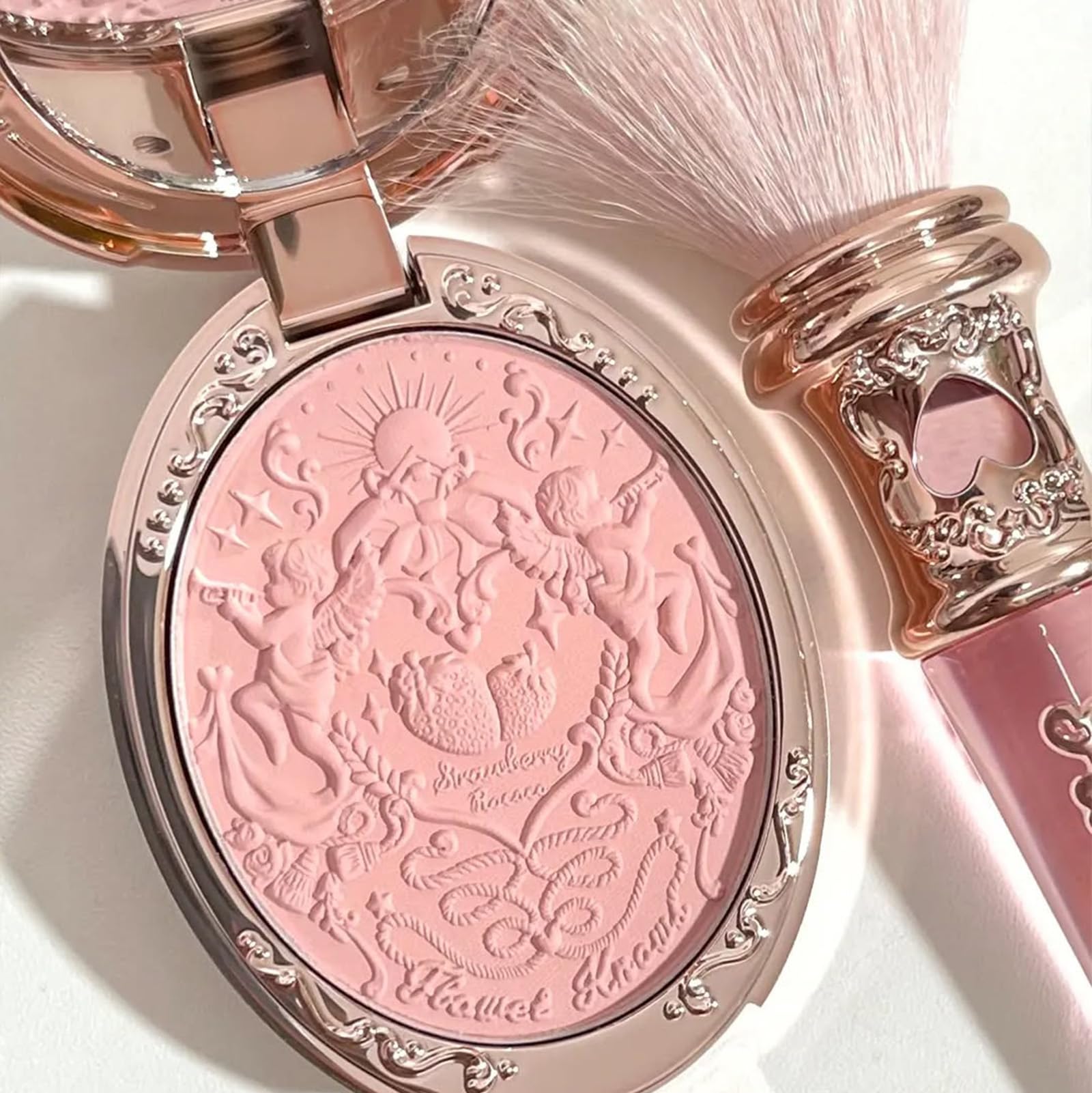 Flower Knows Angel Chanson swatch shows delicate peach-pink glow.