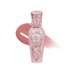 Flower Knows lip lacquer bottle closeup showing glossy glow and long-lasting hydration.