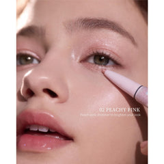 Flower Knows Shell's Jewel creamy pencil undereye highlighter for quick, even coverage.