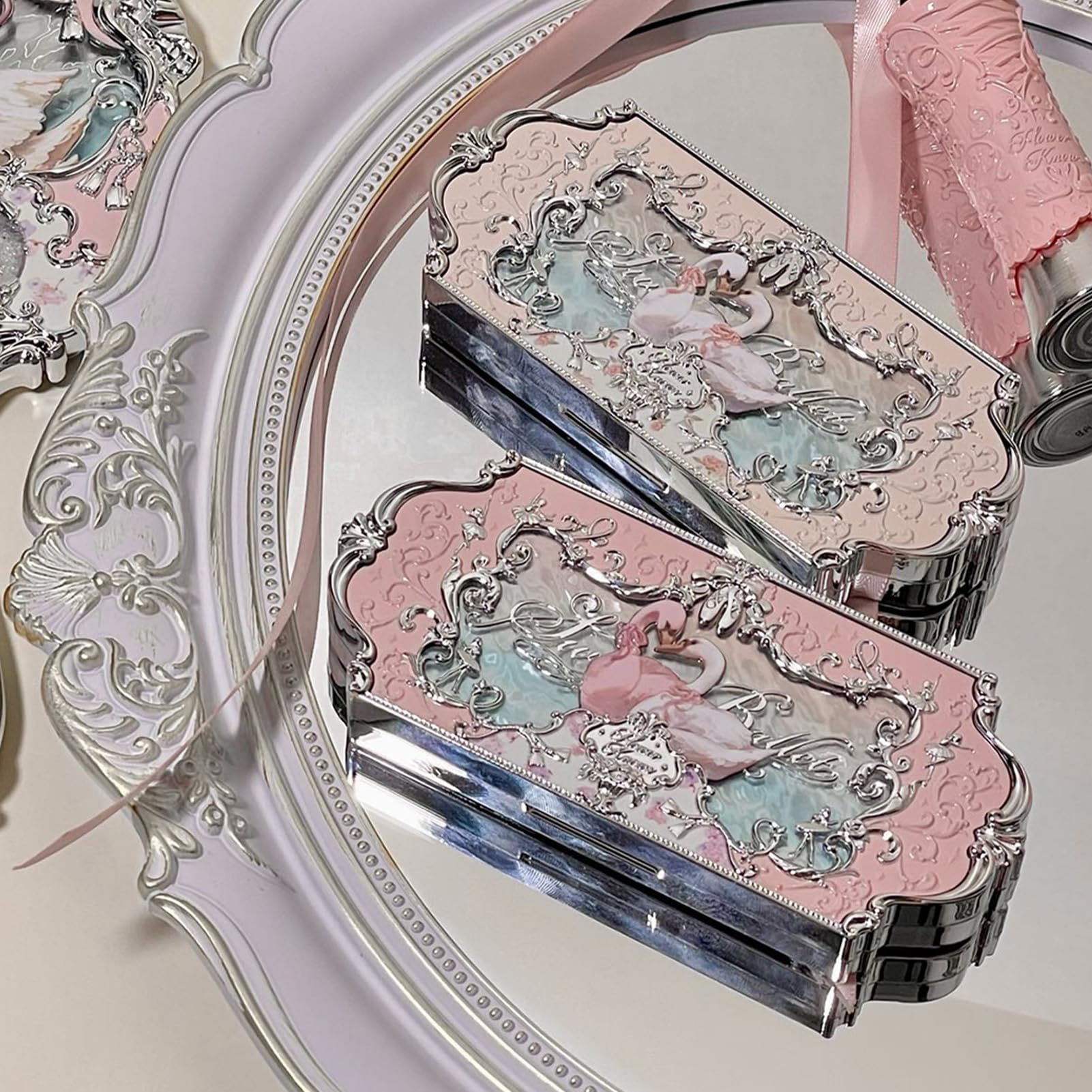 Flower Knows Swan Palette mirror offers quick touch ups on the go.